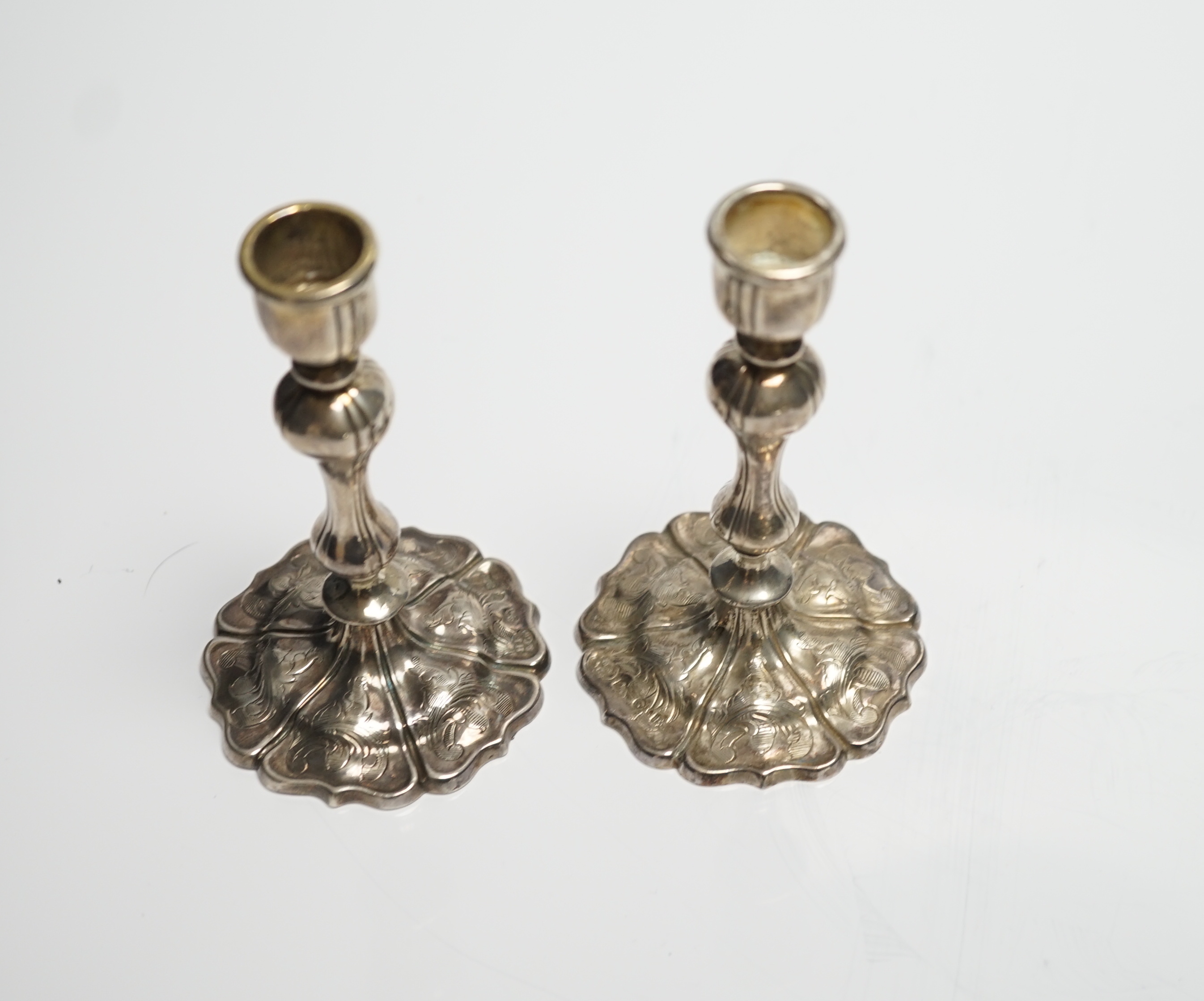 A pair of Victorian engraved silver taper sticks, by Hawksworth, Eyre & Co, Sheffield, 1848, 10.7cm, 97 grams.